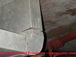 Photograph of loose supply duct connection metal duct work