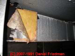Photo of  loose HVAC duct fiberglass falling off (C) InspectApedia.com