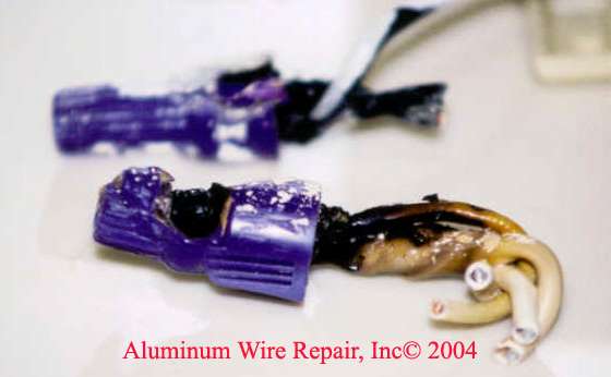 How can you improve the safety of aluminum wiring in a house?
