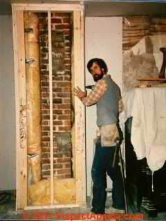 Wall cavity at chimney showing chimney repairs before adding insulation (C) Daniel Friedman 28 West Street Wappingers Falls ca 1986