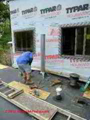 Metal chimney during installation © D Friedman at InspectApedia.com 