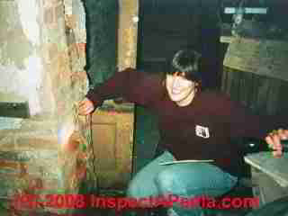 Split brick chimney in a basement (C) Daniel Friedman