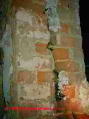 Split brick chimney in a basement (C) Daniel Friedman
