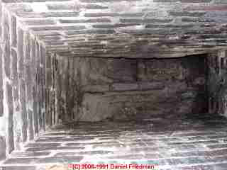 Photograph of an unlined brick chimney flue.