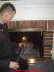 Preparing to inspect a chimney flue with a camera (C) Daniel Friedman