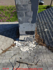 Chimney obstructs roof valleys causing chimney damage and risking roof leaks or even an un-safe chimney flue (C) Inspectapedia.com Taylor P