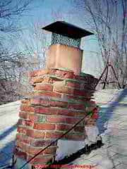 Photograph of a damaged masonry chimney.