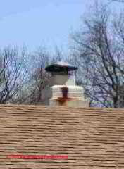 Rusted out metal chimney and cap (C) Daniel Friedman