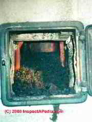 Chimney cleanout left open (C) Daniel Friedman