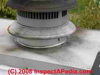 Damaged, concave, leaky chimney crown/cap seal on wood framed chimney chase (C) Daniel Friedman