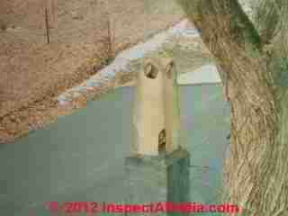 Chimney pot addition to an existing masonry chimney © D Friedman at InspectApedia.com 
