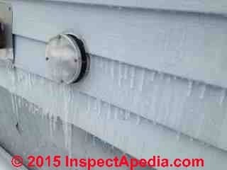 Ice on siding and wet areas traced to improperly installed sidewall vent high efficiency gas furnace (C) InspectApedia Carole Rowley