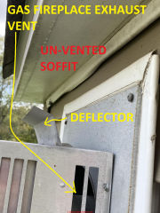 Gas fireplace vent too close to soffit, has deflector (C) InspectApedia.com Rebecca