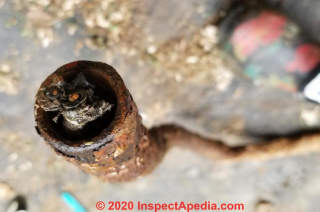 Asbestos used in antique electrical conduit (C) InspectApedia.com Kim