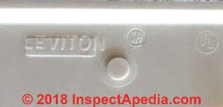 Leviton stamp inside of an electrical receptacle cover or faceplate (C) InspectApedia.com