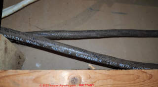 Canadex fabric insulated electrical wire in a 1990s Canadian home (C) InspectApedia.com Brittany
