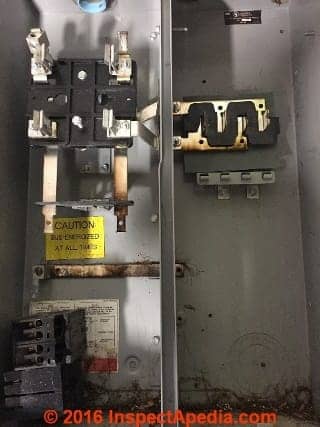 Overheating burns in a Challenger electrical panel (C) InspectApedia SM