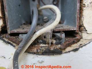 Improper securing of electrical box to wall -  loose (C) Daniel Friedman