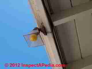 Unsafe outdoor lighting © D Friedman at InspectApedia.com 