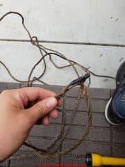 Old electrical wires ends exposed - can be unsafe (C) InspectApedia.com CadacioC