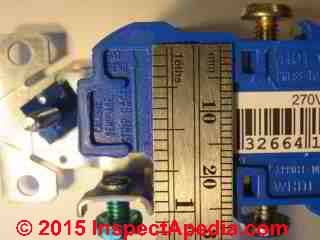 Strip gauge on an electrical receptacle shows how much insulation to remove when back-wiring the device. (C) Daniel Friedman