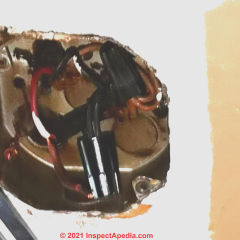 Electrical box with red and black wires to be identified (C) InspectApedia.co NiQi