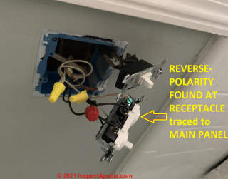 Reversed polarity found at receptacle traced back to mis-wiring in the electrical panel (C) InspectApedia.com Polarity