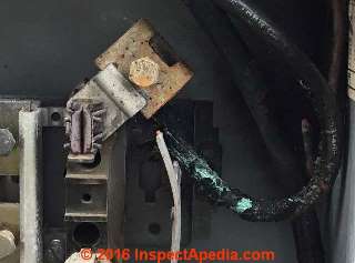 SEC wire damaged in electric meter pan (C) InspectApedia.com PA DF