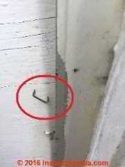Metal staple that conducted damaged SEC wire current to ground & to metal siding (C) InspectApedia.com PA DF