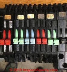 Colored breakers help identify  Zinsco or GTE Sylvania Zinsco circuit breakers (C) Daniel Friedman