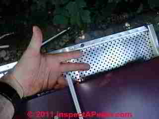 Stainless steel roof screen © D Friedman at InspectApedia.com 