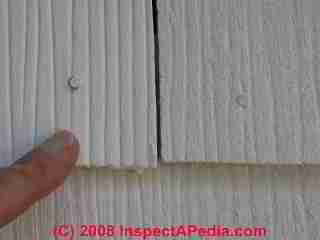 New and old fiber cement and asbestos cement shingles side by side (C) Daniel Friedman