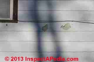 New and old fiber cement and asbestos cement shingles side by side (C) Daniel Friedman