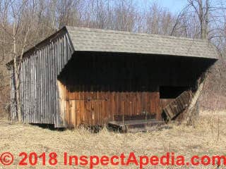 Board and batten siding used on an outbuilding in the U.S. (C) Daniel Friedman at InspectApedia.com