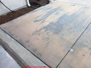 Brown stains on concrete driveway   (C) InspectApedia.com Shaun 