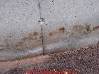 Brown stains on concrete foundation (C) Inspectapedia.comCurtis