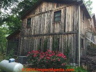 Black stains on cypress board siding, Arkansas (C) InspectApedia RH