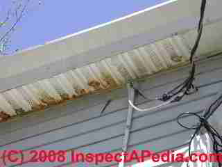 Soffit intake venting blocked © D Friedman at InspectApedia.com 