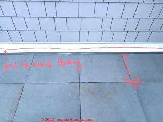 water leak on exterior stone wall of patio (C) InspectApedia.com Alex