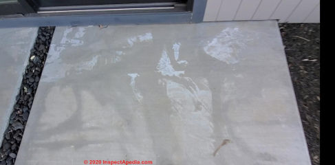 Plastic cover stains on new concrete (C) InspectApedia.com Jeff