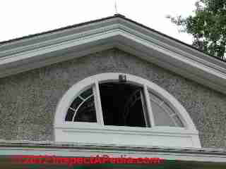 Round top window in stuccoed exterior wall © D Friedman at InspectApedia.com 