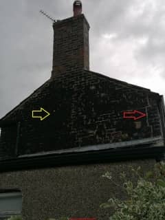 Black tarry stains on brick home (C) InspectApedia.com Bex