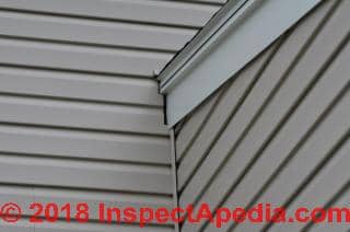 Wet area on foundation below siding may come from siding leak higher on wall (C) Inspectapedia.com JJ 