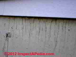Leak stains below vinyl siding © D Friedman at InspectApedia.com 