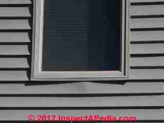 Vinyl Siding buckling & loose (C) Daniel Friedman