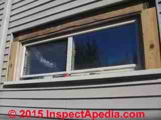 Stripping window trim to find leaks at walls (C) InspectAPedia GS