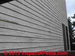 Rippled buckled vinyl siding (C) InspectApedia JB