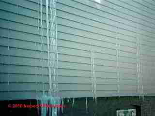 Leaks behind vinyl siding form ice (C) Daniel Friedman