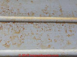 Yellow brownish stains on siding (C) InspectApedia.com Ian