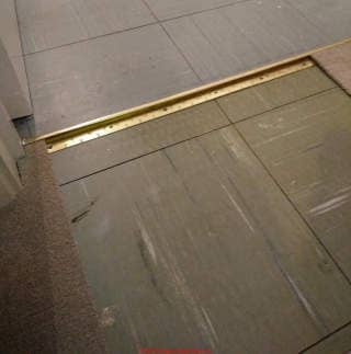 12 inch asbestos-suspect floor tile in the UK (C) InspectApedia.com Edward